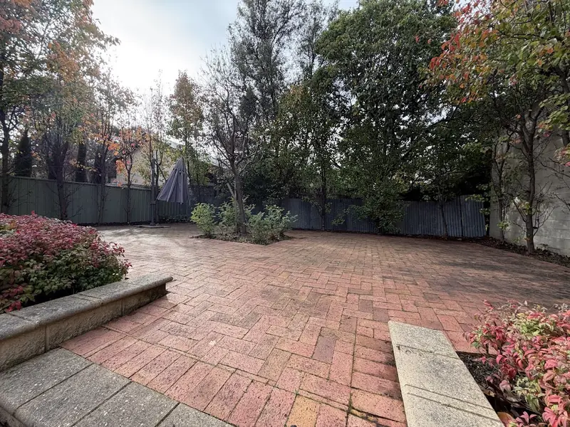 Commercial garden clean up by Garden Grit in Norwood, Adelaide: paved courtyard cleared, beds tidied and hedges trimmed